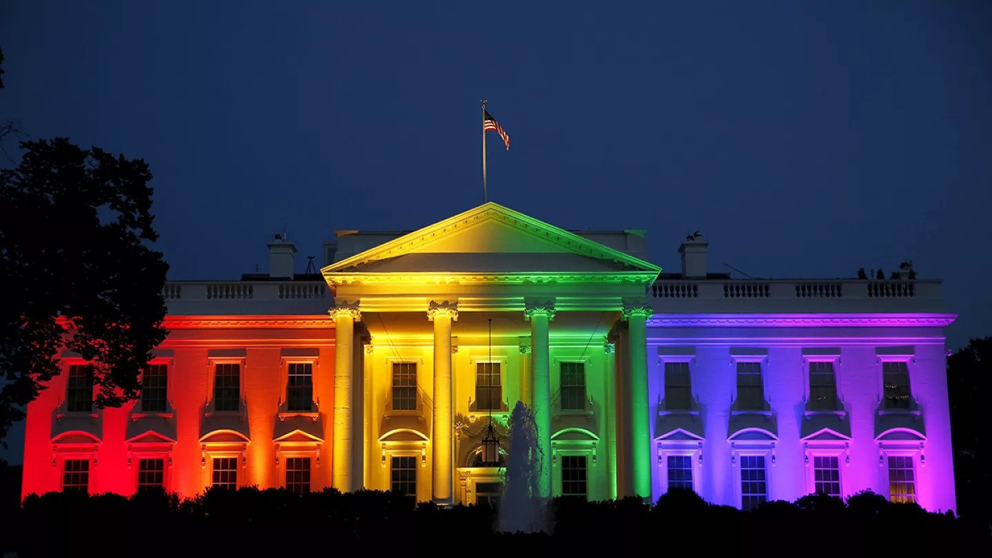 An image of the White House lit up in rainbow lights after the legalization of gay marriage.